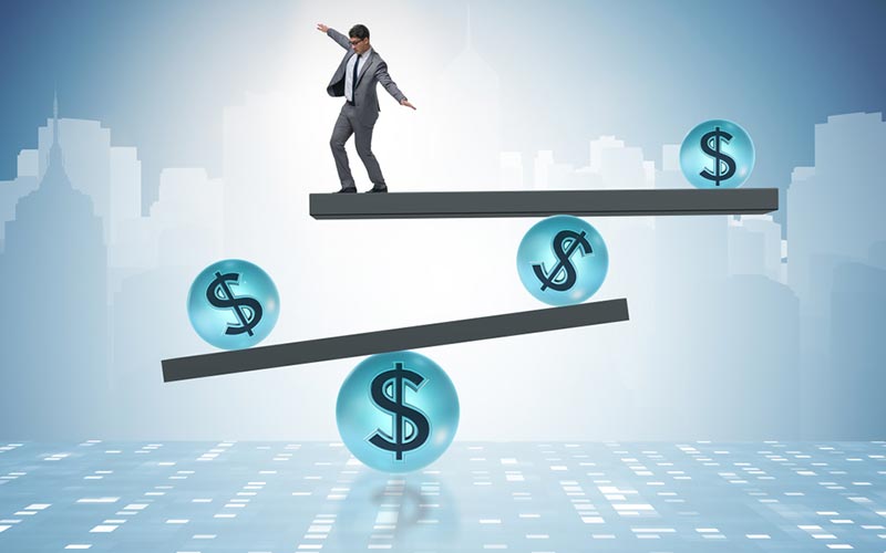 person balancing on top of platforms with dollar symbols as fulcrums, conveying balancing benefit options